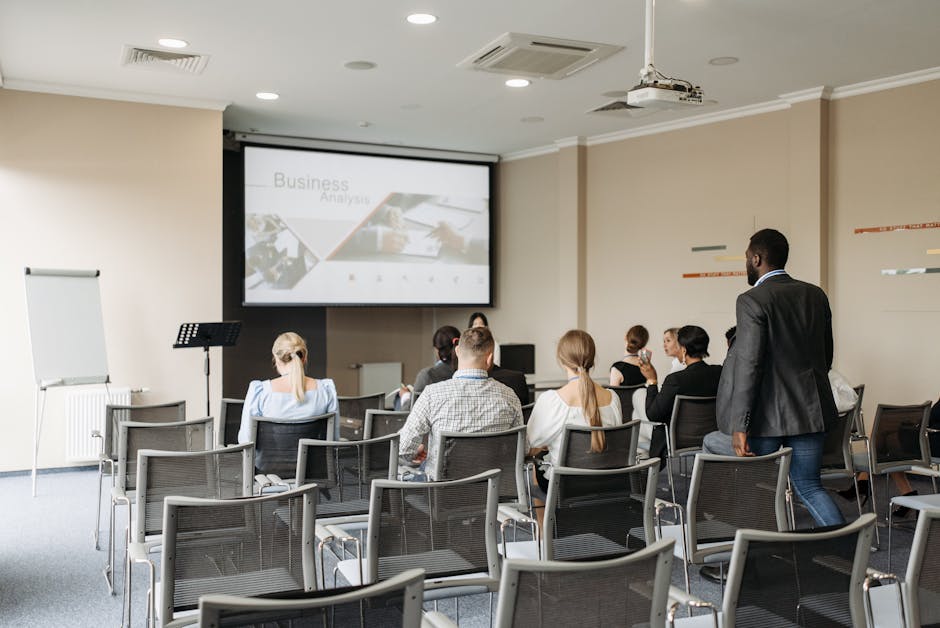 A presentation deck displayed on a screen in a meeting